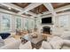 Bright living room with coffered wood ceiling, fireplace, hardwood floors, and comfortable seating at 337 Evian Way, Mount Pleasant, SC 29464