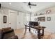 Office features a wooden desk, and decor on the walls with a ceiling fan at 337 Evian Way, Mount Pleasant, SC 29464