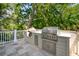 Outdoor kitchen area featuring a built-in stainless steel grill, perfect for entertaining guests at 337 Evian Way, Mount Pleasant, SC 29464