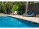 Beautiful pool with water features and comfortable lounge chairs, perfect for relaxing on sunny days at 337 Evian Way, Mount Pleasant, SC 29464
