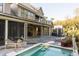 Beautiful backyard pool and deck with lounge seating, perfect for outdoor relaxation and entertaining at this luxurious home at 34 Eugenia Ave, Kiawah Island, SC 29455