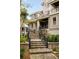 Inviting front entrance with brick stairs, elegant landscaping, and a charming covered porch leading to the home at 34 Eugenia Ave, Kiawah Island, SC 29455