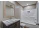 Well-lit bathroom with a vanity, framed mirror, and a combined tub and shower unit at 409 Peacock Ln, Summerville, SC 29483