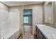 Well-lit bathroom featuring a tub, vanity, and a modern mirror, creating an open feel at 409 Peacock Ln, Summerville, SC 29483