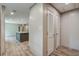 Hallway view leading to the kitchen with modern flooring and closet space at 409 Peacock Ln, Summerville, SC 29483