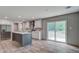 Beautiful kitchen featuring a large island, stainless steel appliances, and a sliding glass door leading to the backyard at 409 Peacock Ln, Summerville, SC 29483