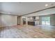 Open-concept living space with recessed lighting, plank floors, an island, and a stainless steel refrigerator at 409 Peacock Ln, Summerville, SC 29483