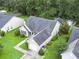 Aerial view of the home, highlighting the manicured lawn, attached garage, and driveway at 5276 Copley Cir, Summerville, SC 29485