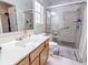 Bathroom with updated fixtures, glass shower, and neutral-toned vanity at 5276 Copley Cir, Summerville, SC 29485