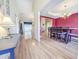 Open-concept home featuring a dining room with wood floors and an elegant chandelier at 5276 Copley Cir, Summerville, SC 29485