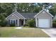Charming single-story home features a one-car garage and well-maintained landscaping in a tree-lined neighborhood at 5276 Copley Cir, Summerville, SC 29485