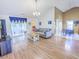 Spacious living room with vaulted ceilings, lots of natural light, and wood floors at 5276 Copley Cir, Summerville, SC 29485