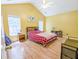 Bright main bedroom with two windows, vaulted ceiling, and wood floors at 5276 Copley Cir, Summerville, SC 29485