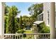 Serene backyard view from the porch featuring a pool, lush greenery, and an inviting outdoor space at 6 Judith St, Charleston, SC 29403
