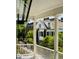 Picturesque balcony view with white pillars overlooking lush greenery and neighboring houses at 6 Judith St, Charleston, SC 29403