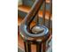 Close-up view of an elegant wood banister with a decorative spiral design at 6 Judith St, Charleston, SC 29403