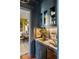Stylish bar area with elegant cabinetry, marble countertops, and views into the dining room at 6 Judith St, Charleston, SC 29403