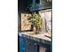 Close-up view of the bar area with marble countertops, a sink, and custom fixtures at 6 Judith St, Charleston, SC 29403