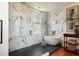Luxurious bathroom featuring marble tiled walls, freestanding tub, and modern fixtures at 6 Judith St, Charleston, SC 29403