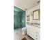 Bathroom features a glass walk-in shower with subway tile and vanity with marble countertop at 6 Judith St, Charleston, SC 29403