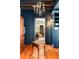 Closet area featuring custom shelves, drawers, wood floors and a decorative chandelier at 6 Judith St, Charleston, SC 29403