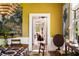 View of the dining room with decorative panels on the walls, leading into the living room at 6 Judith St, Charleston, SC 29403