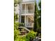 Relaxing outdoor dining area with lush landscaping and elegant porch views at 6 Judith St, Charleston, SC 29403