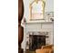 Close-up of a fireplace with ornate details and stylish decor, showcasing the home's classic architectural features at 6 Judith St, Charleston, SC 29403
