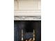 Close-up of a fireplace with marble surround and decorative elements at 6 Judith St, Charleston, SC 29403