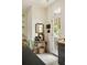 Kitchen nook displays antique decorations and an antique mirror with a view of the french door to the outside at 6 Judith St, Charleston, SC 29403