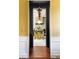 View through a doorway to a modern kitchen with a central island and stylish pendant lighting at 6 Judith St, Charleston, SC 29403