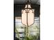 Unique gothic style pendant light above the kitchen island with stainless steel refrigerator in the background at 6 Judith St, Charleston, SC 29403