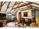 Inviting living room boasts exposed wood beams, comfortable seating, and classic decor at 6 Judith St, Charleston, SC 29403