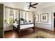 Spacious bedroom with hardwood floors, a four-poster bed, and natural light, showcasing a cozy and inviting atmosphere at 6 Judith St, Charleston, SC 29403