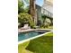 Backyard pool features a lounge chair, mature landscaping, and a garden view of the home's exterior at 6 Judith St, Charleston, SC 29403