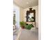 Beautiful porch with decorative mirror, console table, plants, neutral chair, and stylish accents at 6 Judith St, Charleston, SC 29403