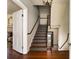 View of the staircase featuring hardwood floors and traditional decor, showcasing the home's classic architectural details at 6 Judith St, Charleston, SC 29403