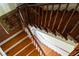 Overhead view looking down an elegant wood staircase with decorative embellishments at 6 Judith St, Charleston, SC 29403