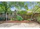Private backyard featuring a brick patio, lush greenery, a bicycle, and a peaceful outdoor retreat at 7 Chadwick Dr # A, Charleston, SC 29407