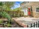 Charming outdoor space features a brick patio, tasteful landscaping, and a cozy, secluded ambiance for relaxation at 7 Chadwick Dr # A, Charleston, SC 29407