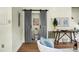 Elegant powder room with a modern sliding barn door adding a touch of rustic charm at 7 Chadwick Dr # A, Charleston, SC 29407