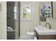 Elegant bathroom with a modern vanity, sleek fixtures, and a walk-in shower with mosaic tile accents at 7 Chadwick Dr # A, Charleston, SC 29407