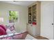 Bedroom featuring a built-in bookcase, a comfortable daybed, and a bright window with outdoor views at 7 Chadwick Dr # A, Charleston, SC 29407