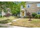 Charming two-story home with stone facade, manicured lawn, and a welcoming front porch at 7 Chadwick Dr # A, Charleston, SC 29407