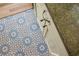 Stunning patterned tile flooring in a bathroom, next to hardwood flooring at 7 Chadwick Dr # A, Charleston, SC 29407