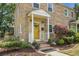 Charming two-story home with yellow brick exterior, covered porch, and beautifully landscaped front yard at 7 Chadwick Dr # A, Charleston, SC 29407