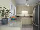 Well-lit kitchen with granite countertops and stainless steel appliances, and natural light at 7 Chadwick Dr # A, Charleston, SC 29407