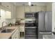 Kitchen with stainless steel appliances, a double oven, and ample storage space at 7 Chadwick Dr # A, Charleston, SC 29407