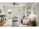Bright living room showcasing hardwood floors, white sofa, and natural light at 7 Chadwick Dr # A, Charleston, SC 29407