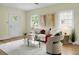 Cozy living room featuring hardwood floors, white sofa with bright decor, and ample natural light at 7 Chadwick Dr # A, Charleston, SC 29407